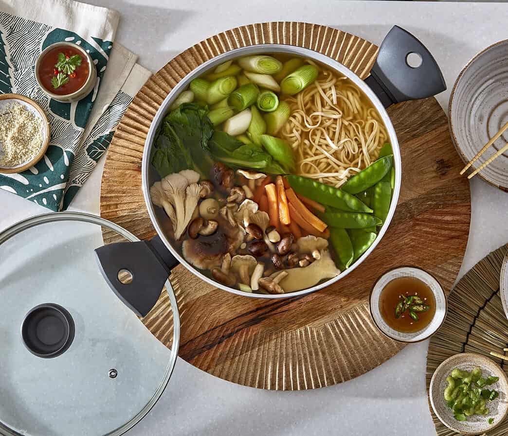 Broth and noodles in the stock pot